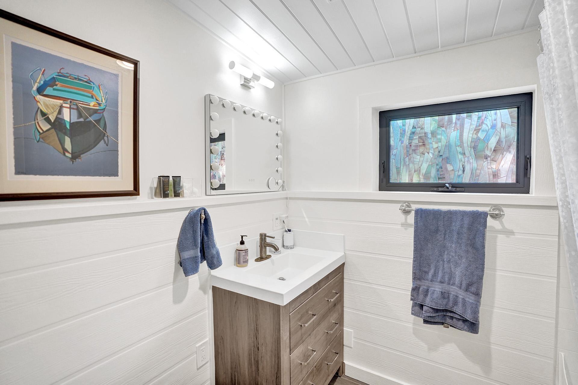 5612 Harding Street Hollywood, FL 33021 - Photo 25 of 59 a bathroom with a sink and a mirror