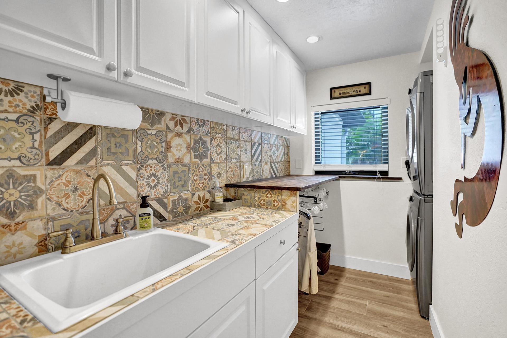 5612 Harding Street Hollywood, FL 33021 - Photo 26 of 59 a bathroom with a tub sink and a mirror