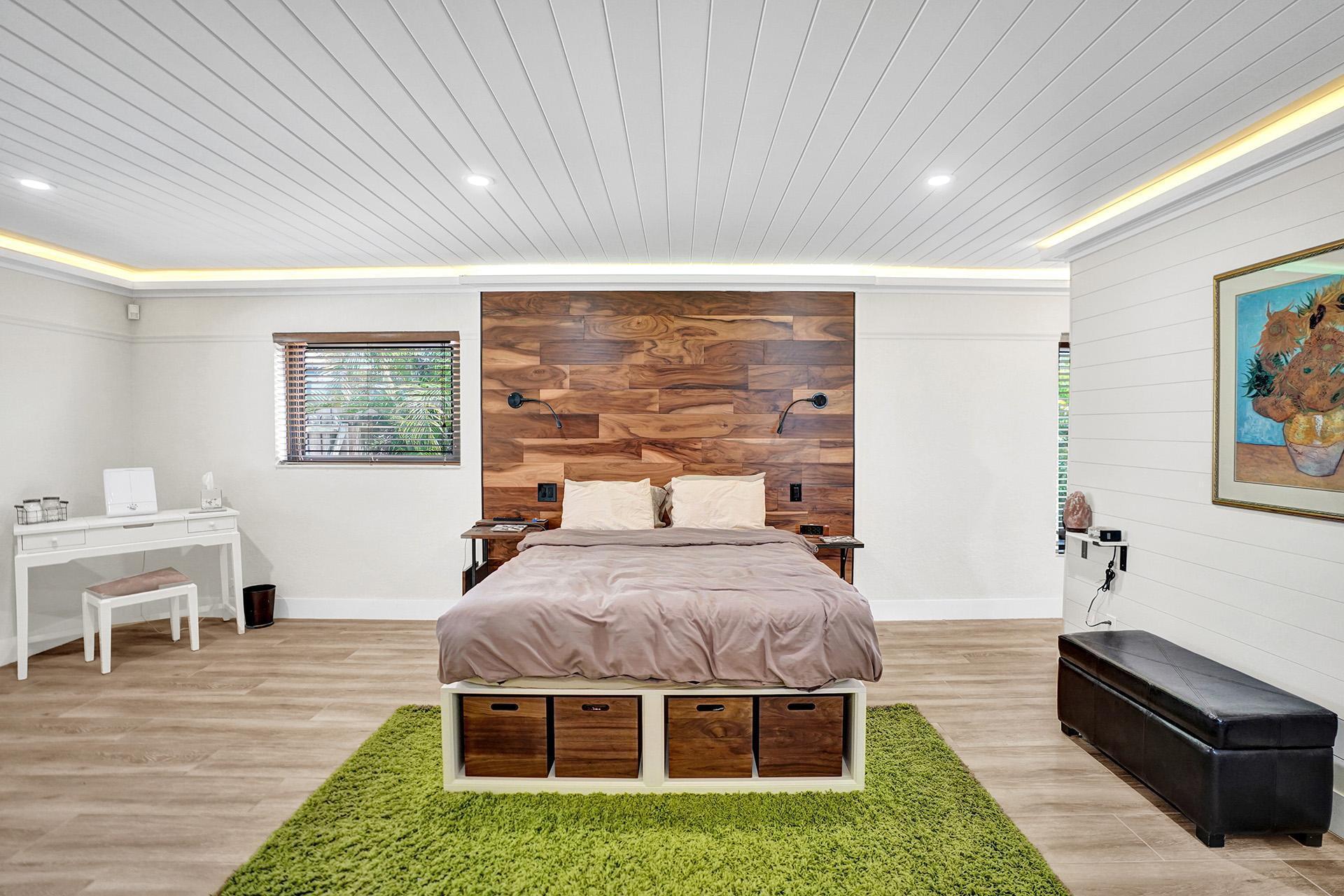 5612 Harding Street Hollywood, FL 33021 - Photo 29 of 59 a bed room with a bed and a chair