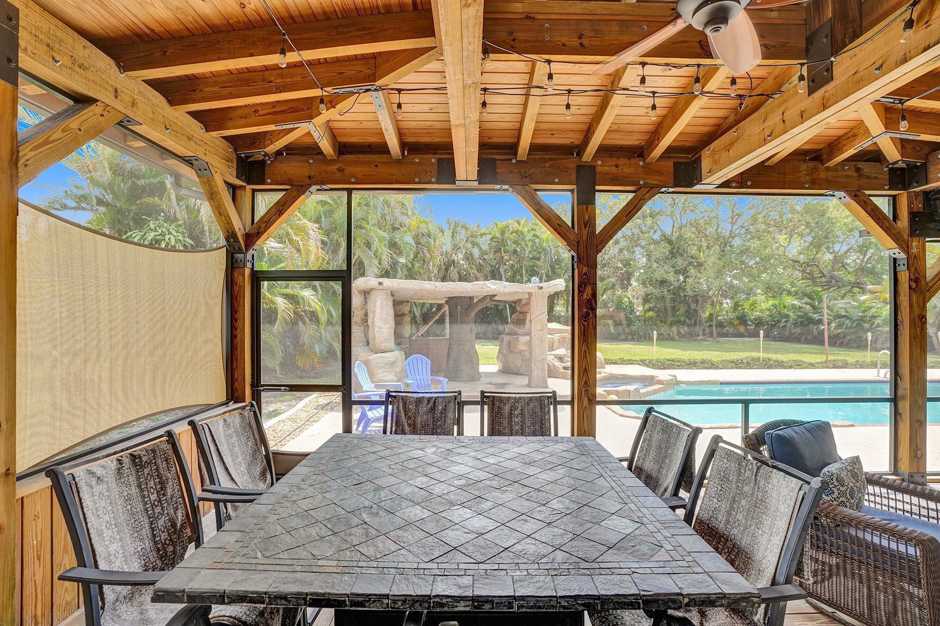5612 Harding Street Hollywood, FL 33021 - Photo 35 of 59 a view of porch with furniture and a window