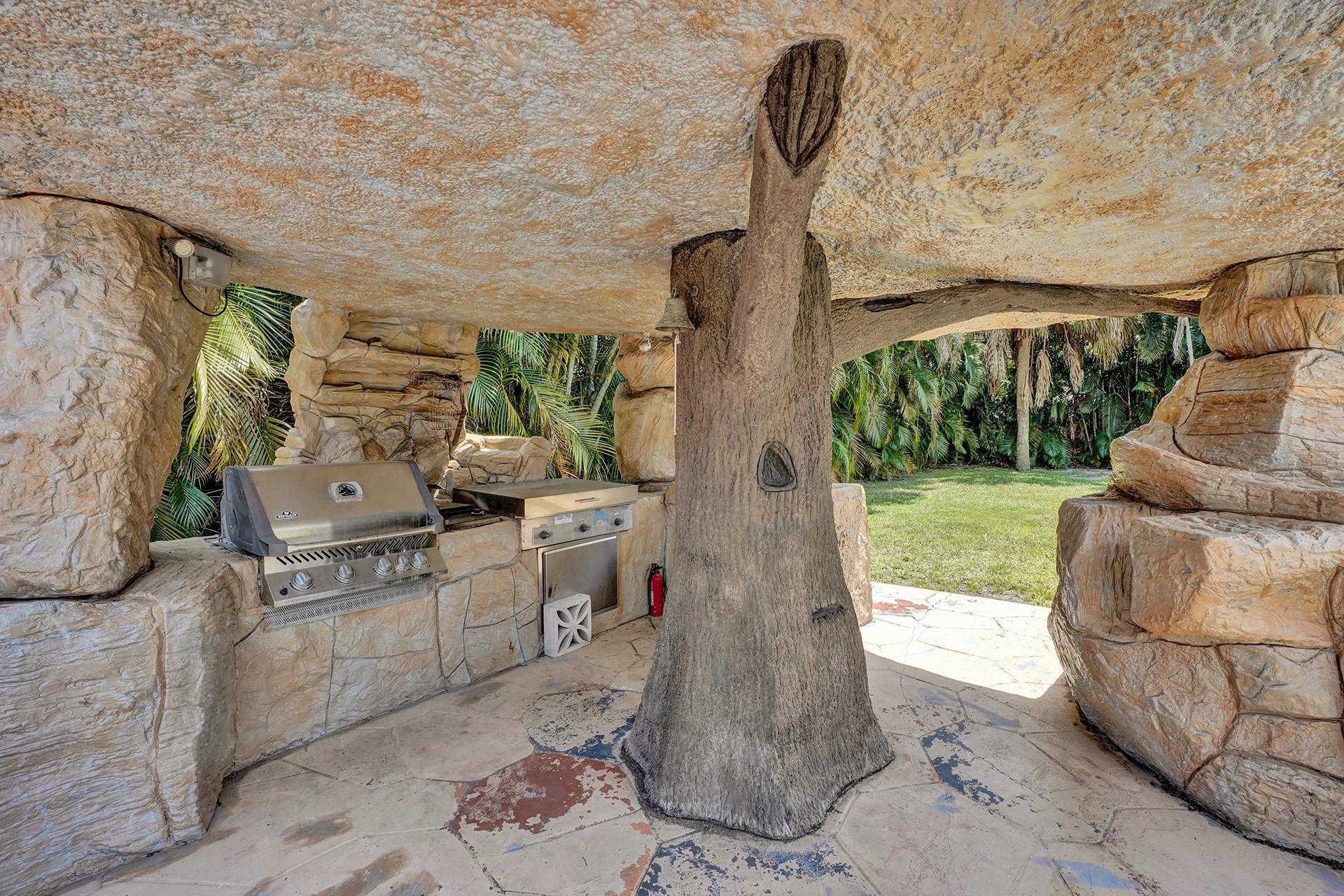 5612 Harding Street Hollywood, FL 33021 - Photo 39 of 59 a living room with furniture and a floor to ceiling window