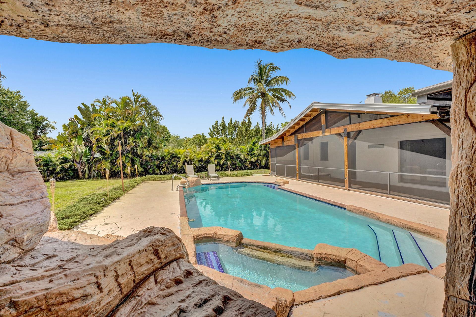 5612 Harding Street Hollywood, FL 33021 - Photo 41 of 59 a view of a swimming pool with a yard
