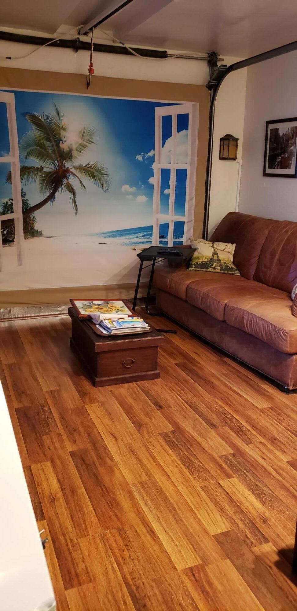 5612 Harding Street Hollywood, FL 33021 - Photo 55 of 59 a living room with a couch and a table