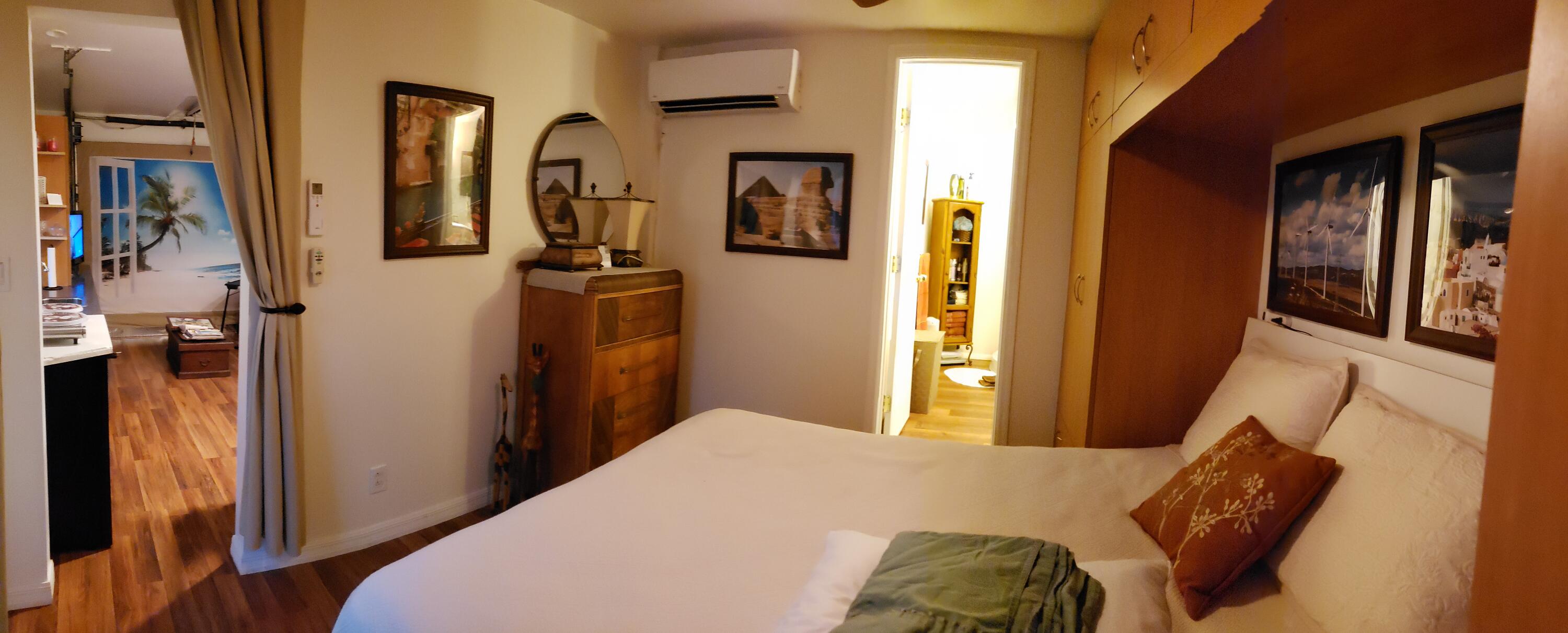 5612 Harding Street Hollywood, FL 33021 - Photo 59 of 59 a bedroom with a bed and a mirror