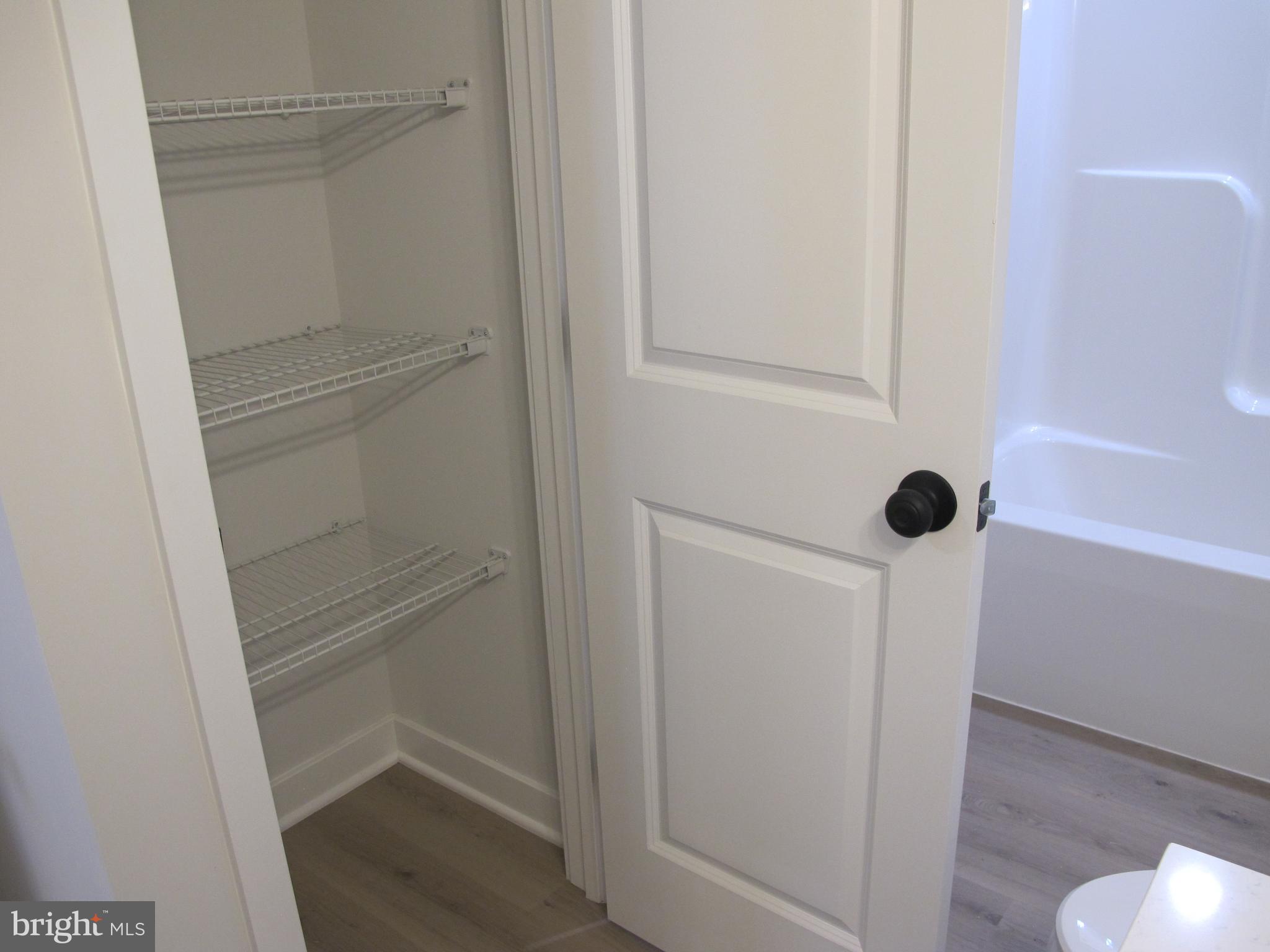 145 9th Street Colonial Beach, VA 22443 - Photo 29 of 51 a bathroom with a glass shower door