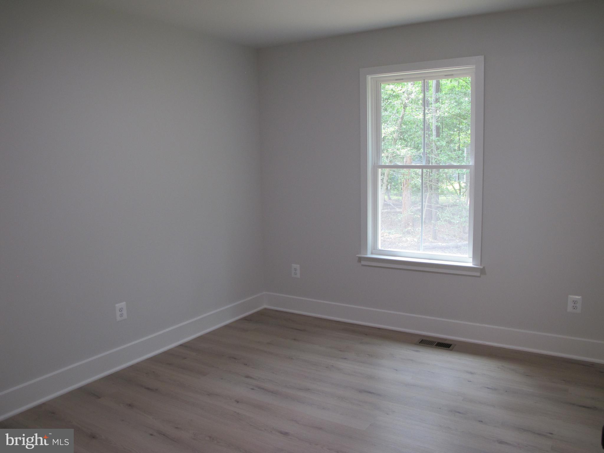 145 9th Street Colonial Beach, VA 22443 - Photo 33 of 51 an empty room with a window