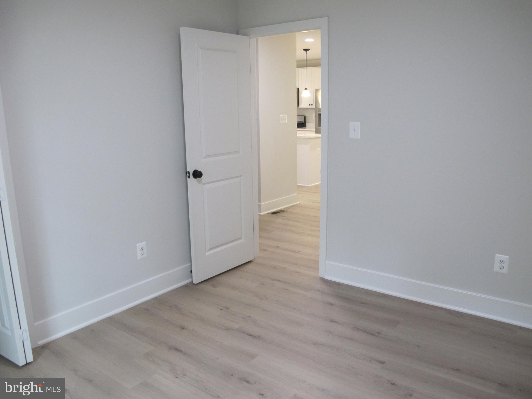 145 9th Street Colonial Beach, VA 22443 - Photo 35 of 51 a view of a hallway with wooden floor