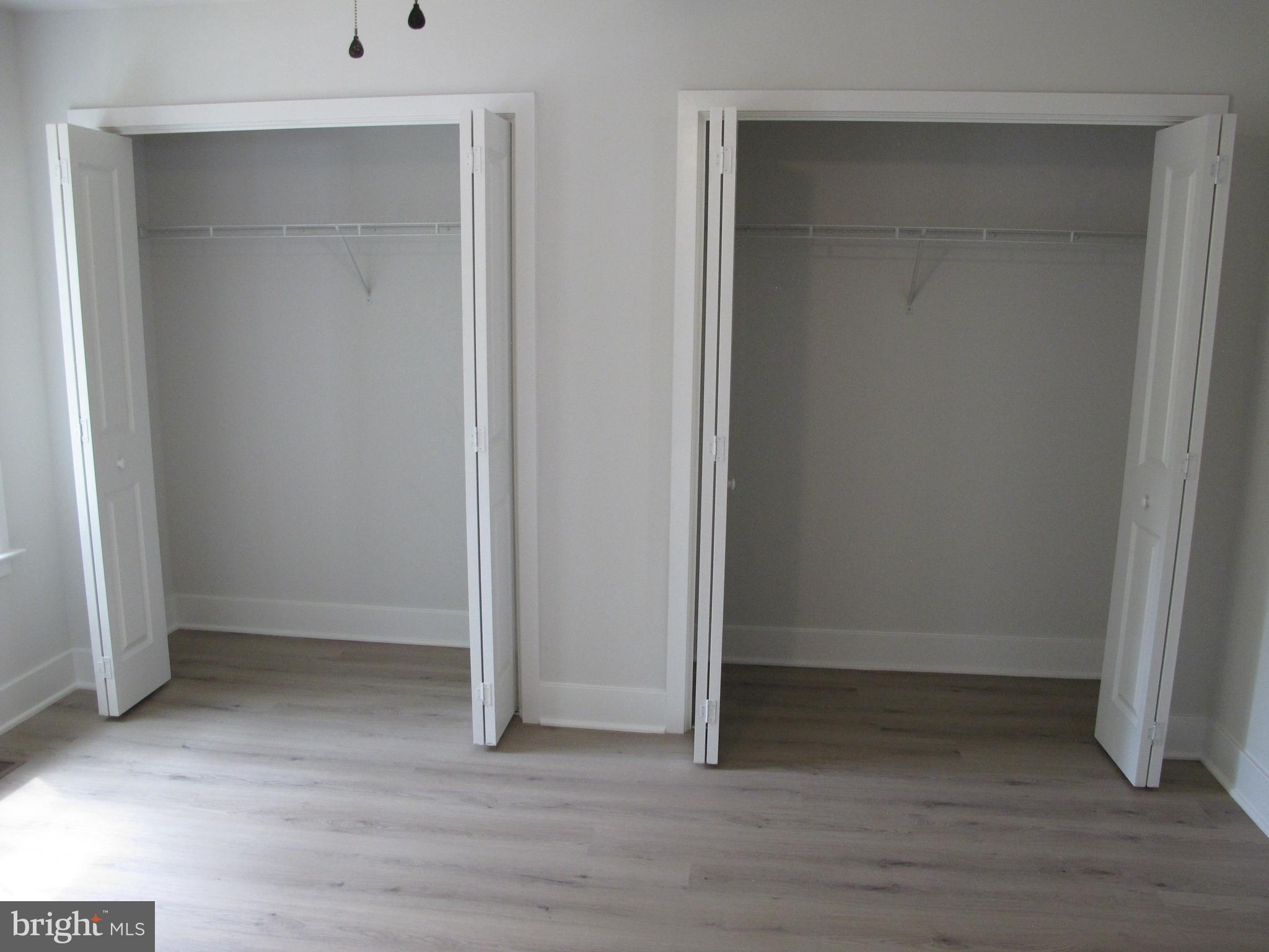 145 9th Street Colonial Beach, VA 22443 - Photo 40 of 51 an empty room with wooden floor and closet