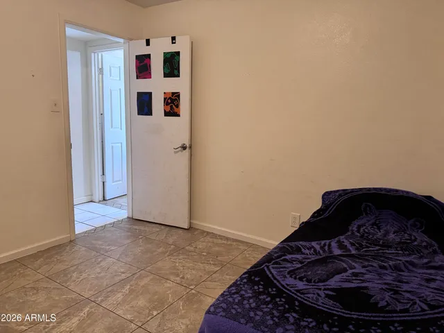 a bedroom with a bed and a cabinets