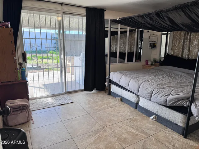 a bedroom with a bed and a walk in closet