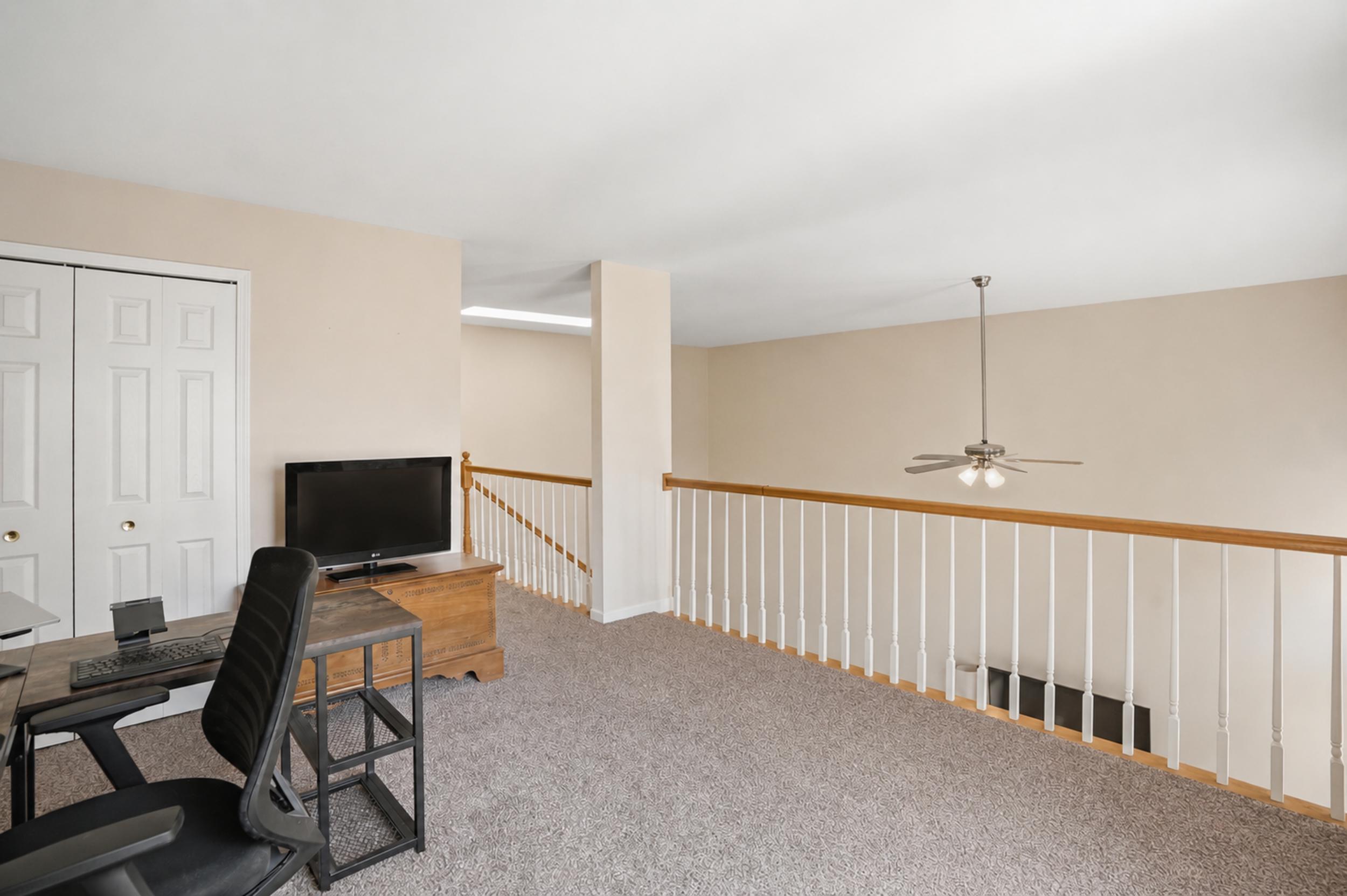 2184 Timberidge Lane Highland, IN 46322 - Photo 13 of 18 a view of a workspace with furniture and a window