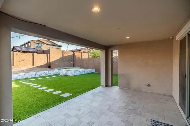 a front view of a house with a yard and a garage