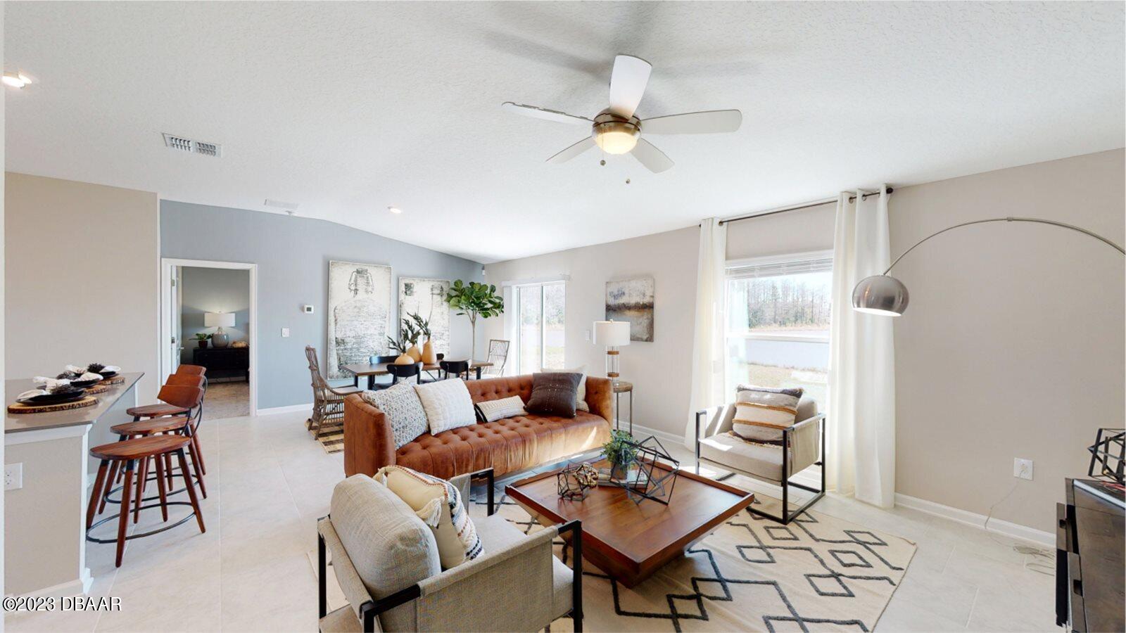 3949 Willowbrook Drive Edgewater, FL 32141 - Photo 3 of 12 OLH_1551_Estates_Pic_Dover_LivingRoom2_M