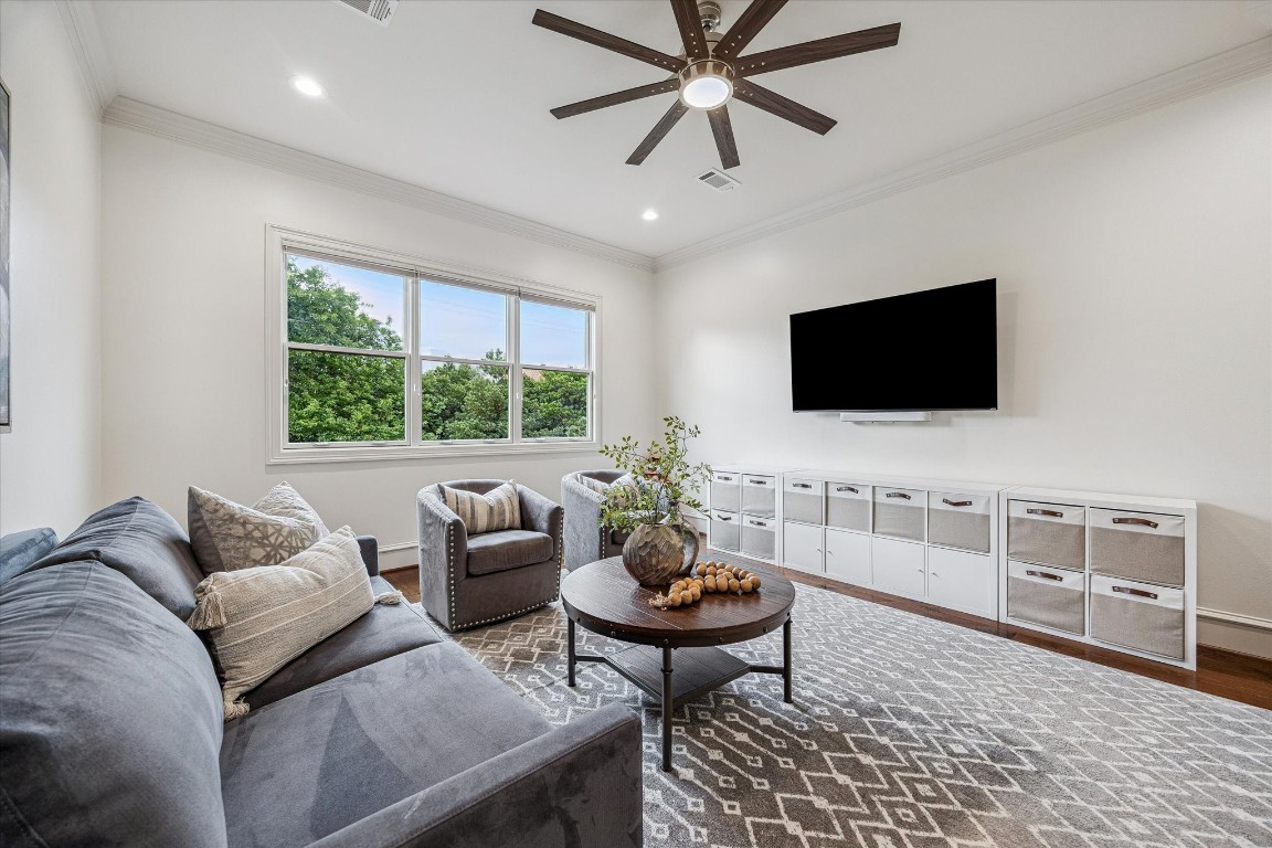 3810 Drake Street Houston, TX 77005 - Photo 31 of 48 a living room with furniture and a flat screen tv