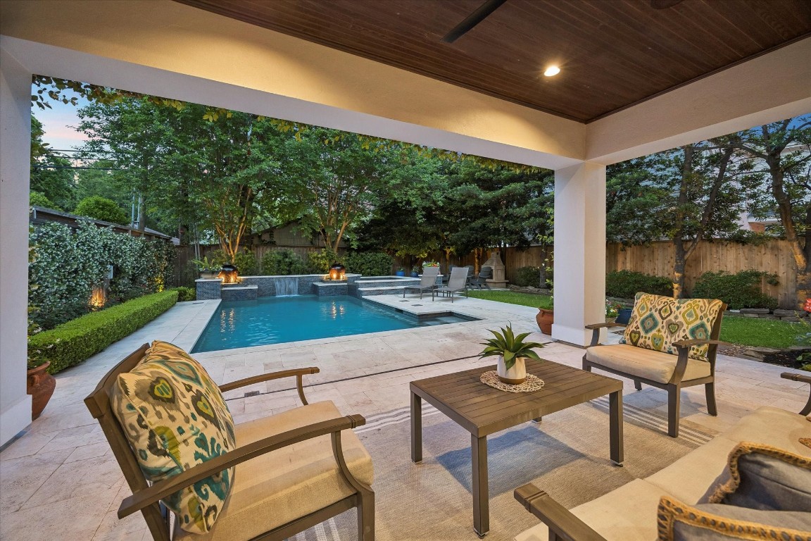 3810 Drake Street Houston, TX 77005 - Photo 35 of 48 a swimming pool with outdoor seating and a patio