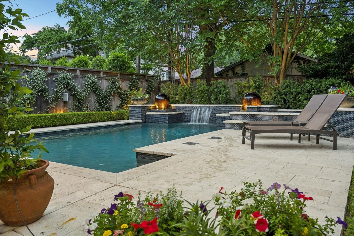3810 Drake Street Houston, TX 77005 - Photo 38 of 48 a view of a swimming pool with a lounge chairs