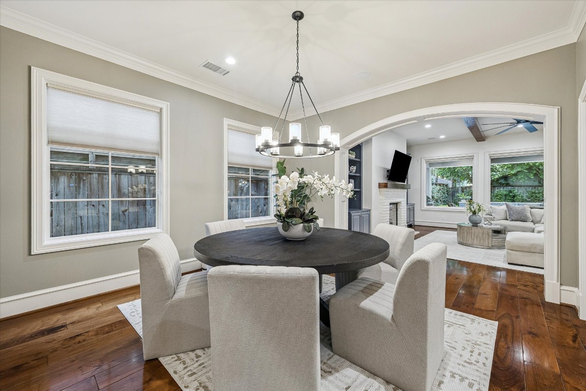 3810 Drake Street Houston, TX 77005 - Photo 5 of 48 a dining room with furniture a chandelier and wooden floor
