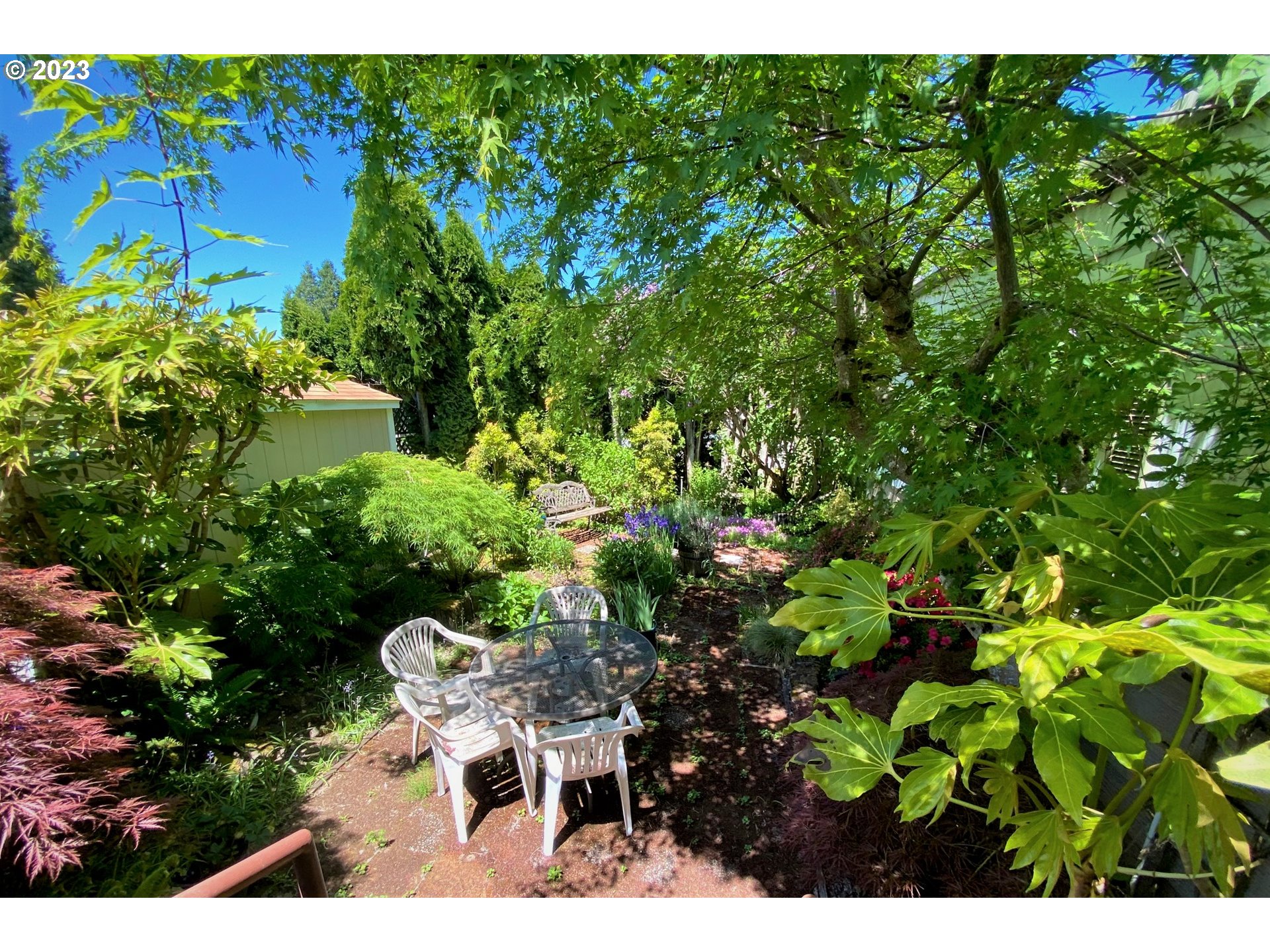 1400 Candlelight Drive, Unit 160 Eugene, OR 97402 - Photo 25 of 31 a view of a garden with plants