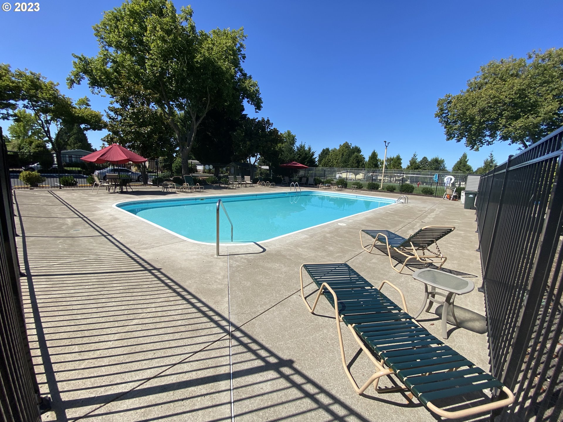 1400 Candlelight Drive, Unit 160 Eugene, OR 97402 - Photo 31 of 31 a view of a swimming pool with lounge chair
