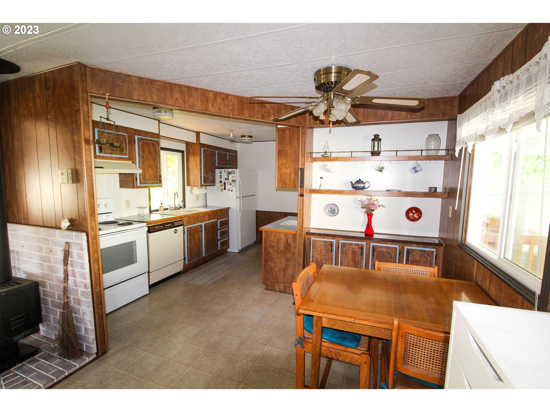 1400 Candlelight Drive, Unit 160 Eugene, OR 97402 - Photo 4 of 31 a kitchen with stainless steel appliances granite countertop a sink and cabinets