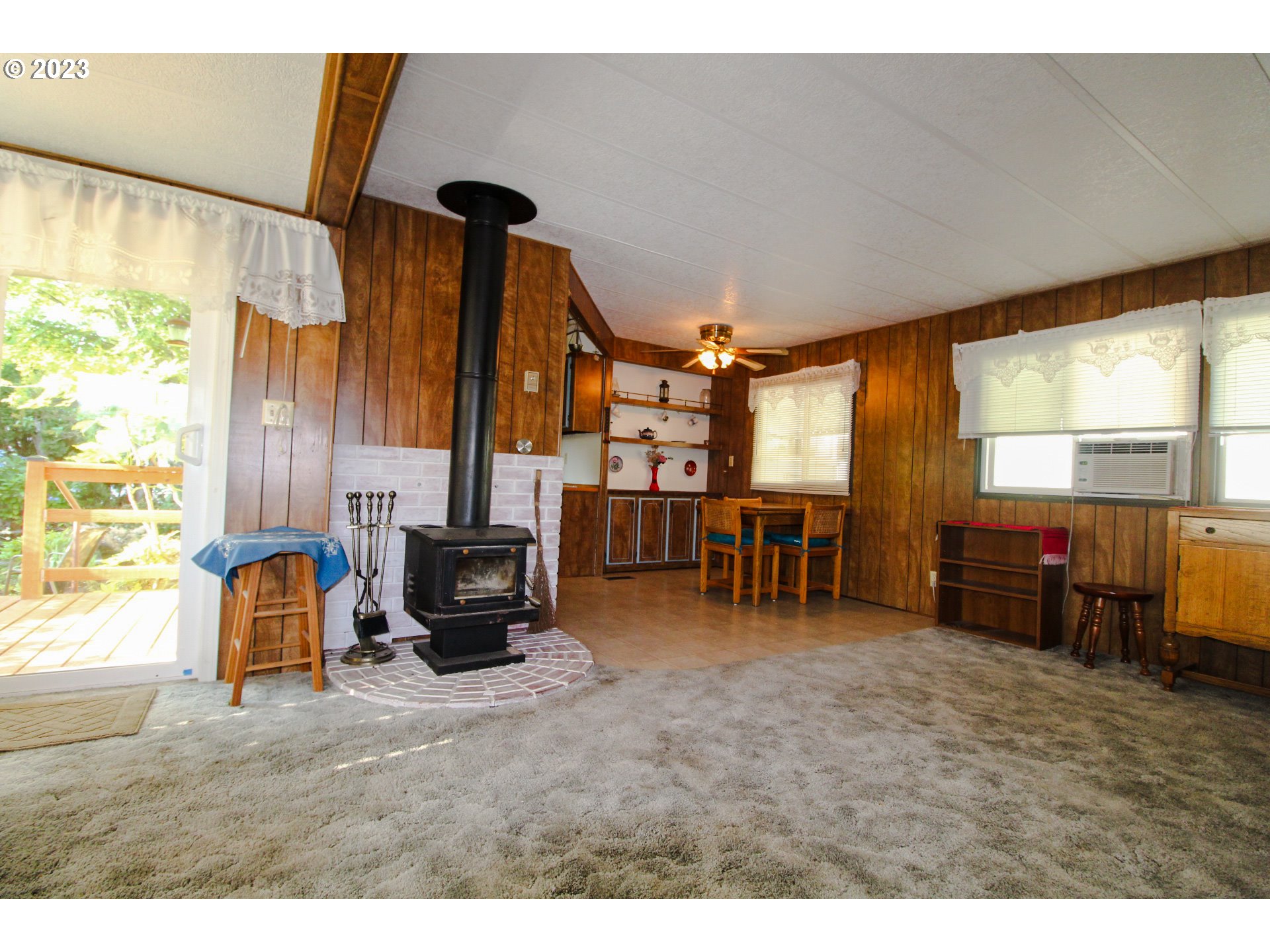 1400 Candlelight Drive, Unit 160 Eugene, OR 97402 - Photo 6 of 31 a living room with furniture and a flat screen tv