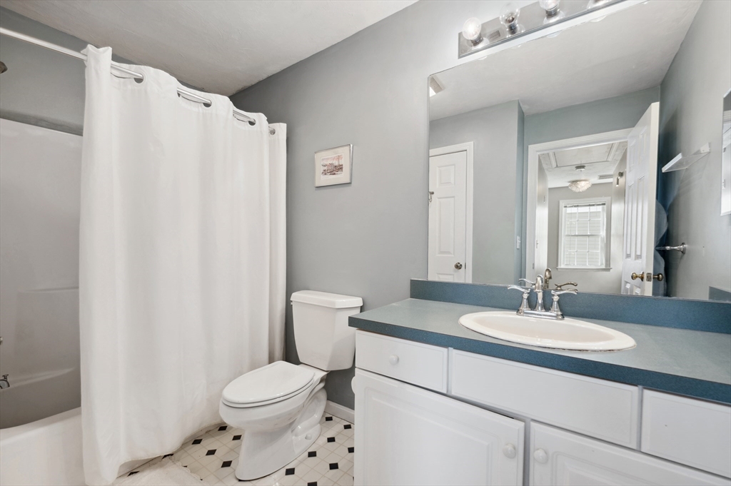 354 Tilden Commons Lane, Unit 354 Braintree, MA 02184 - Photo 12 of 35 a bathroom with a sink toilet and shower
