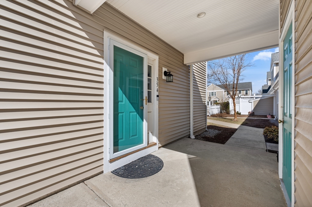 354 Tilden Commons Lane, Unit 354 Braintree, MA 02184 - Photo 19 of 35 a view of a porch with a patio