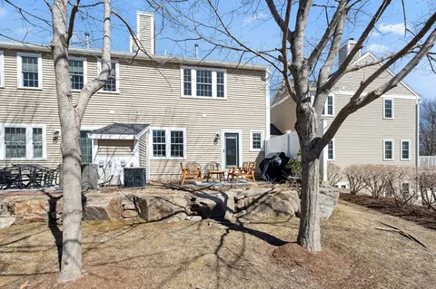 a view of a couches and a fire pit in the patio
