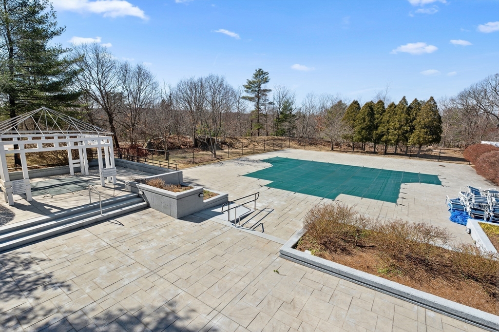 354 Tilden Commons Lane, Unit 354 Braintree, MA 02184 - Photo 32 of 35 a view of a backyard with open kitchen