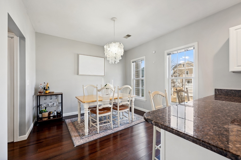 354 Tilden Commons Lane, Unit 354 Braintree, MA 02184 - Photo 6 of 35 a living room with furniture and wooden floor