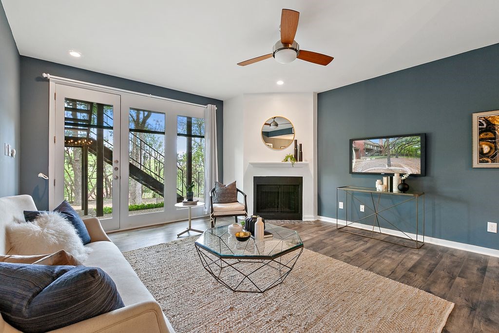 1501 Barton Springs Road, Unit 119 Austin, TX 78704 - Photo 1 of 1 a living room with furniture and a fireplace
