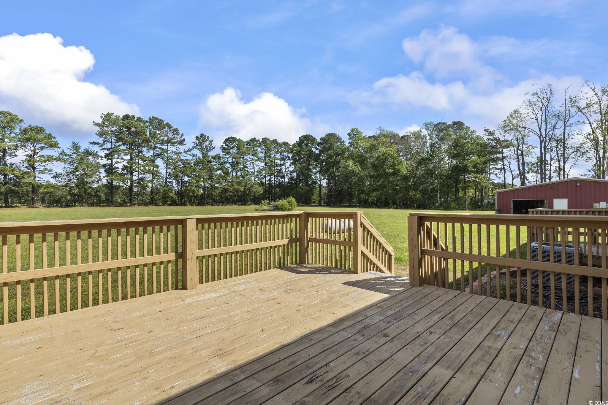 1585 Daisy Road Loris, SC 29569 - Photo 5 of 48 Wooden terrace with a yard