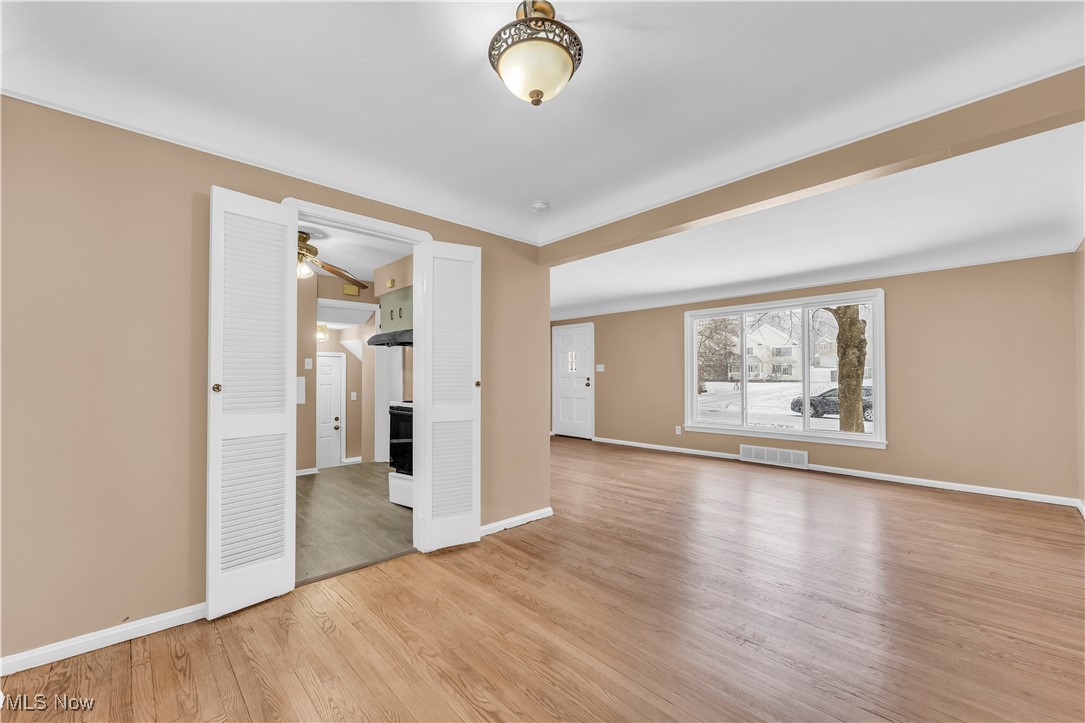 4693 Liberty Road South Euclid, OH 44121 - Photo 8 of 33 Empty room featuring baseboards and light wood-style flooring
