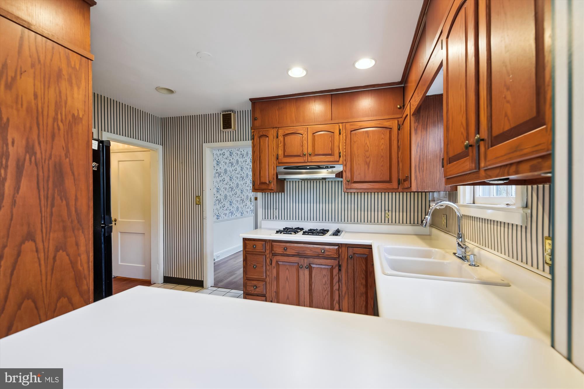 5433 Springlake Way Baltimore, MD 21212 - Photo 15 of 58 a kitchen with stainless steel appliances granite countertop a sink a stove and a refrigerator