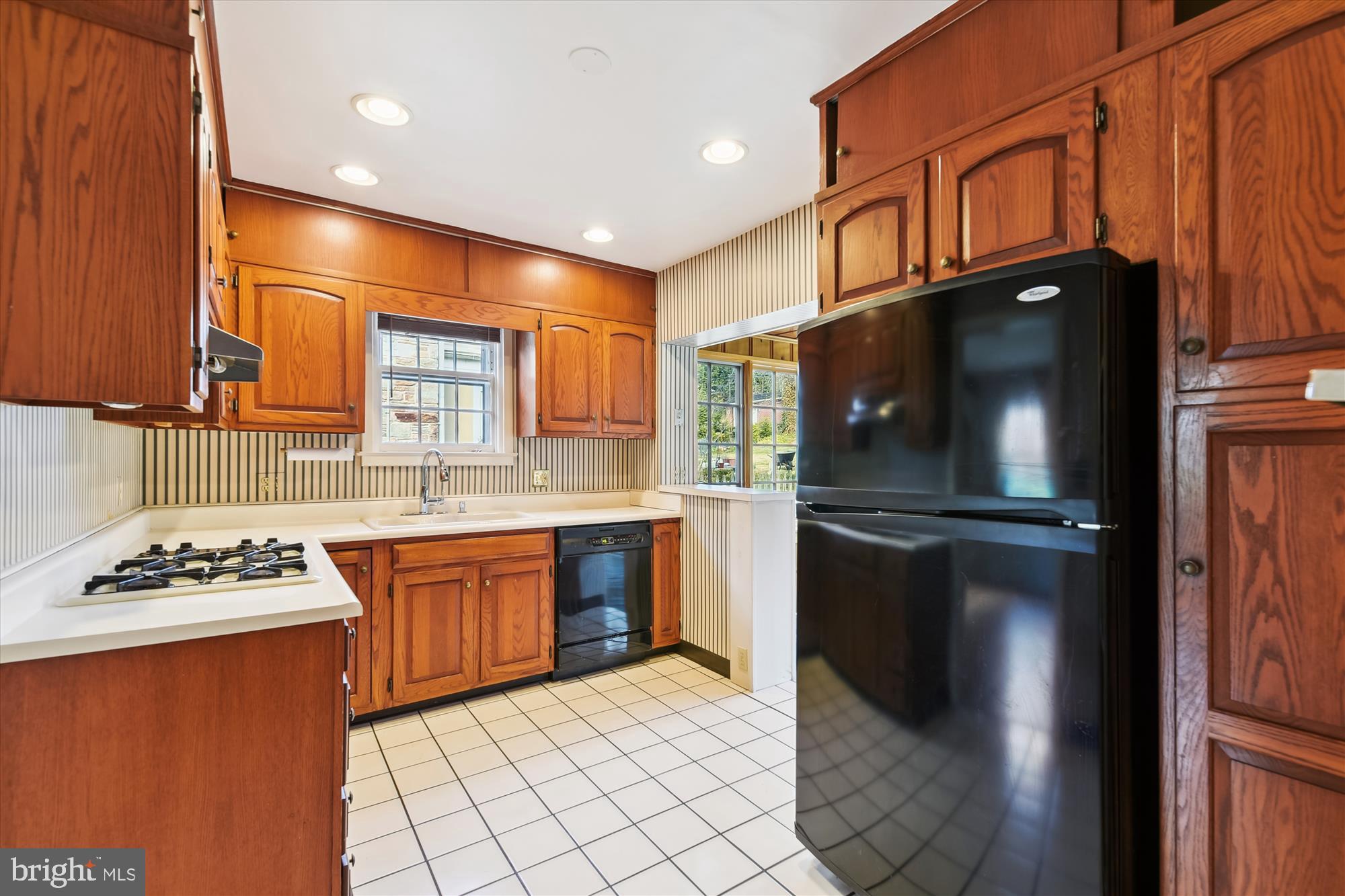 5433 Springlake Way Baltimore, MD 21212 - Photo 16 of 58 a kitchen with stainless steel appliances granite countertop a refrigerator a stove and a sink