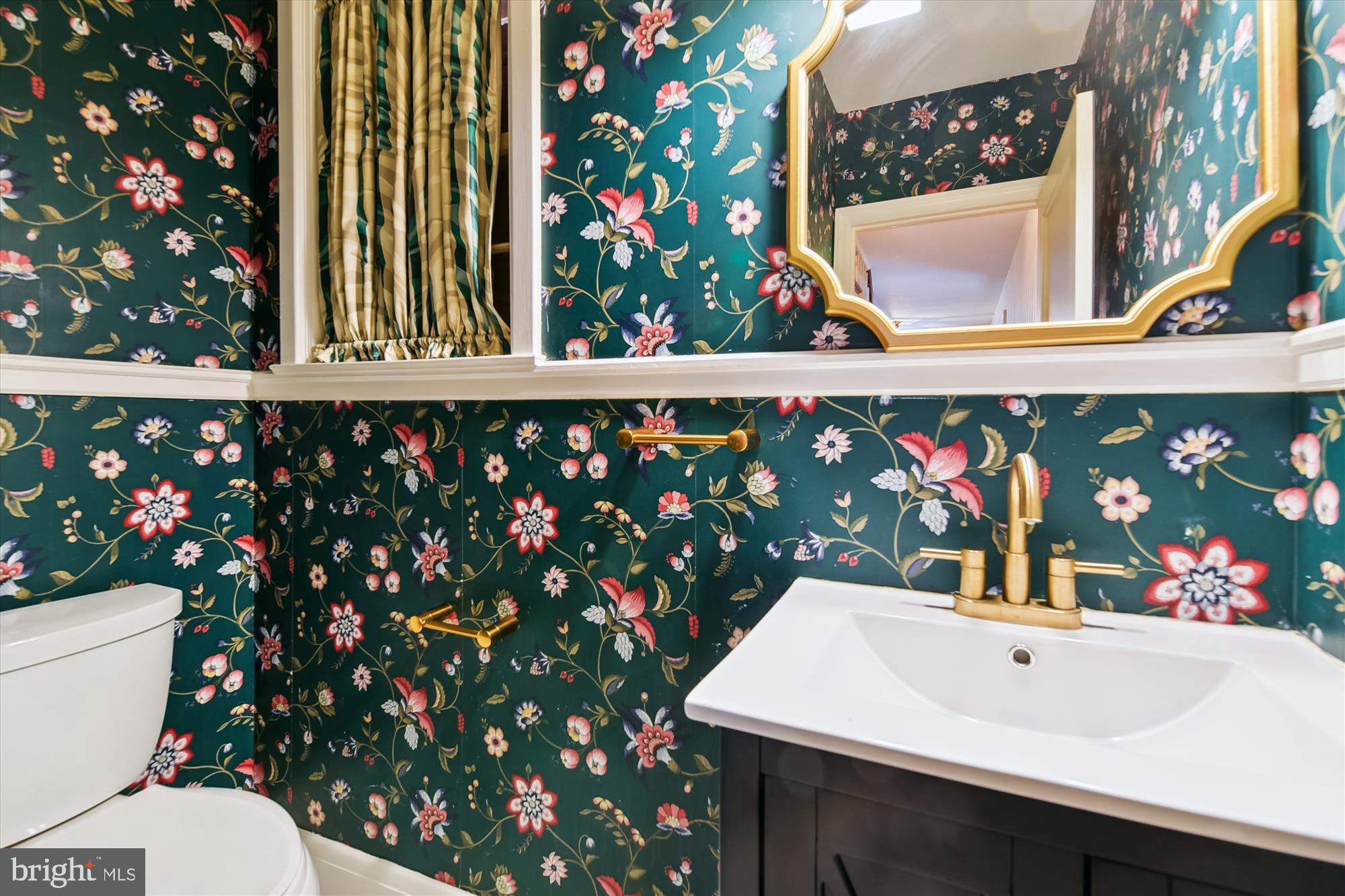 5433 Springlake Way Baltimore, MD 21212 - Photo 21 of 58 a bathroom with a sink mirror and vanity