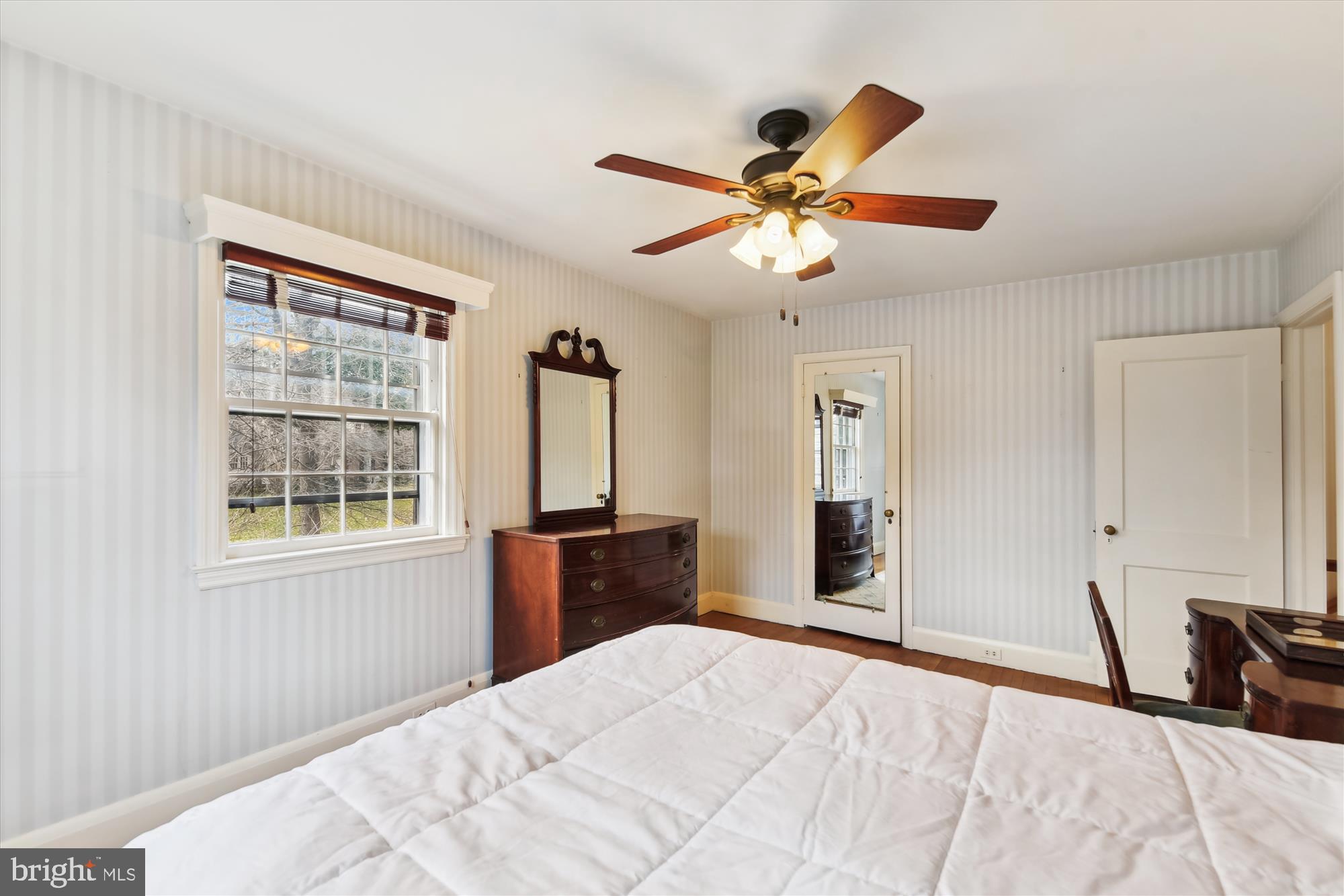 5433 Springlake Way Baltimore, MD 21212 - Photo 30 of 58 a bedroom with a bed and a chandelier