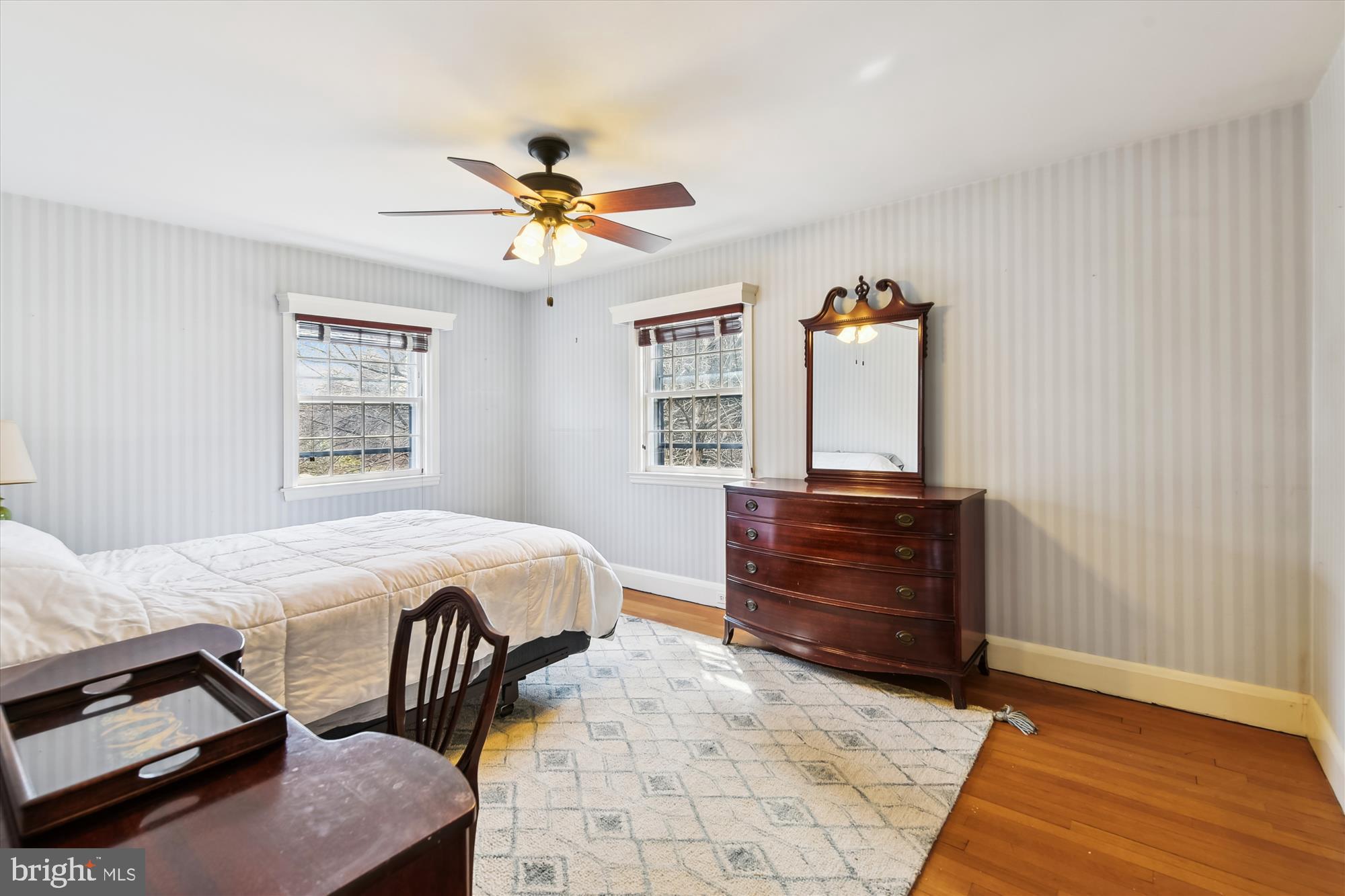 5433 Springlake Way Baltimore, MD 21212 - Photo 31 of 58 a bedroom with a bed and a dresser