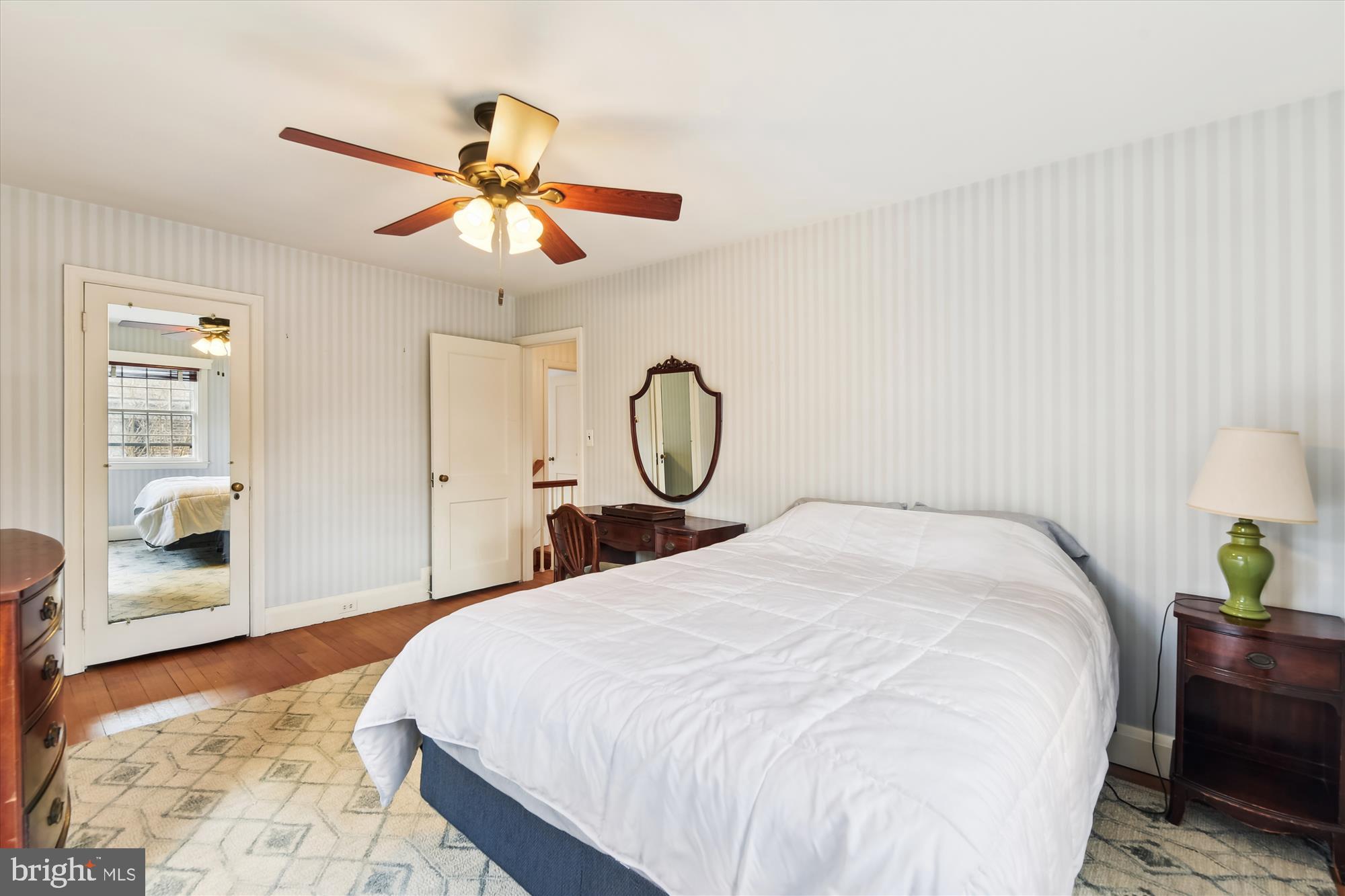 5433 Springlake Way Baltimore, MD 21212 - Photo 32 of 58 a bedroom with a bed and a chandelier