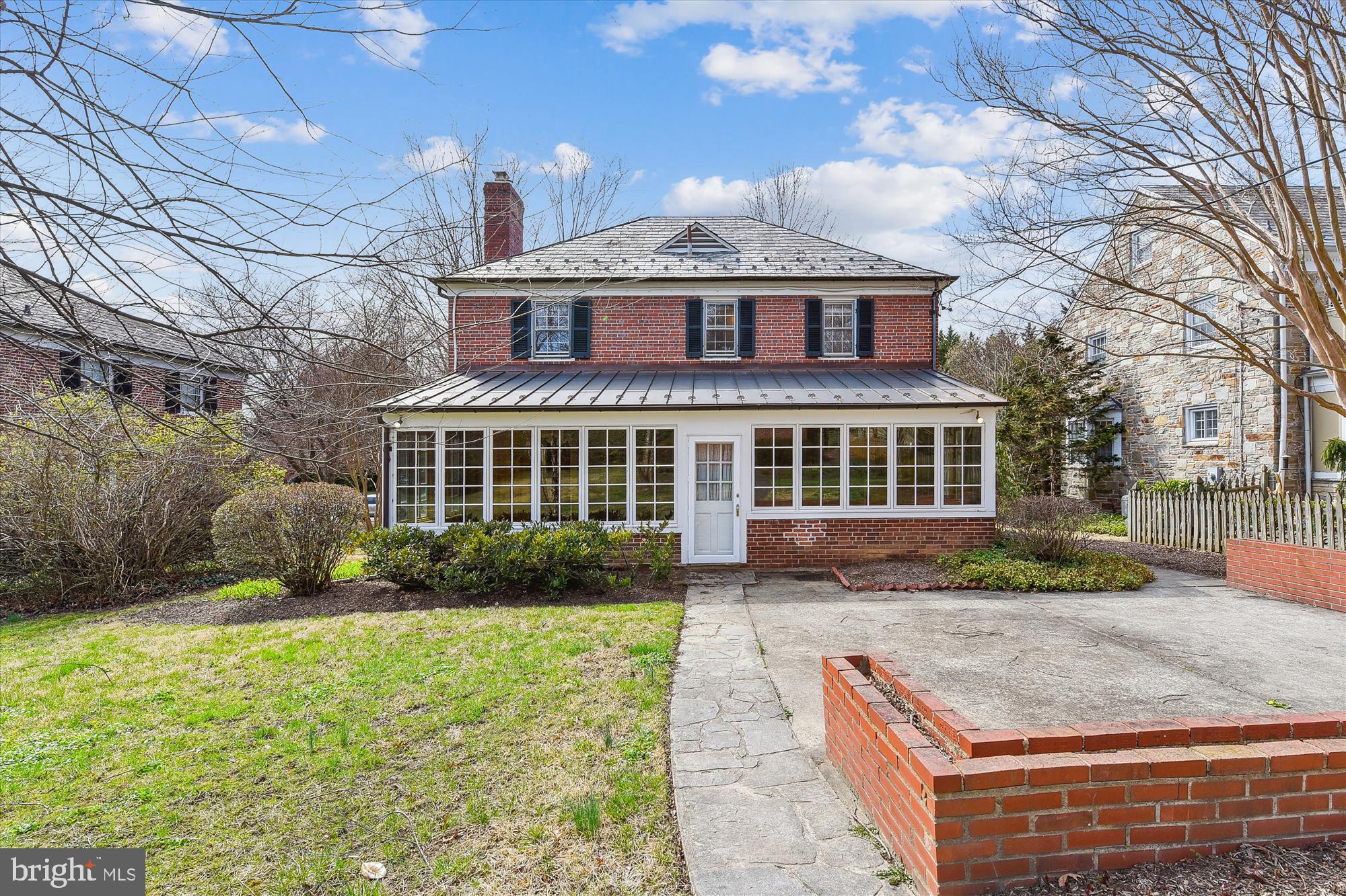 5433 Springlake Way Baltimore, MD 21212 - Photo 46 of 58 a front view of a house with a yard