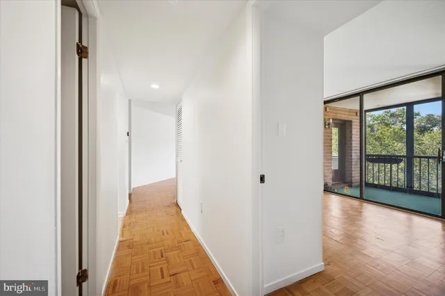 a kitchen with a refrigerator sink and cabinets