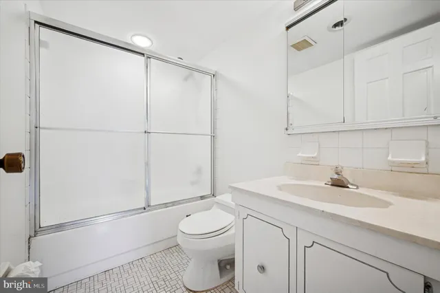 an empty room with a bathroom