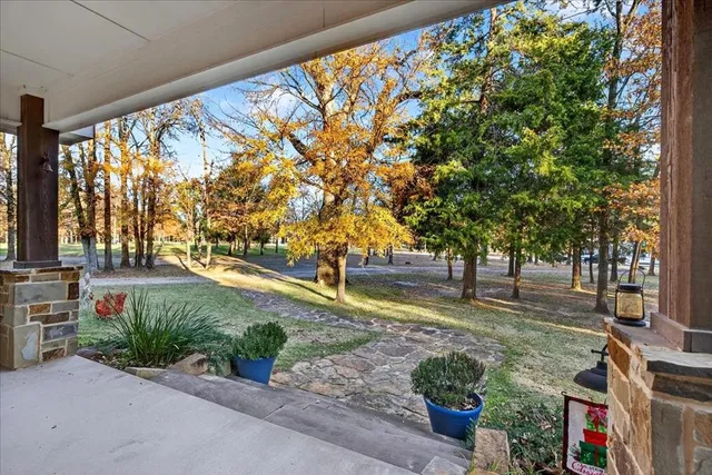 a front view of a house with a yard garage and outdoor seating