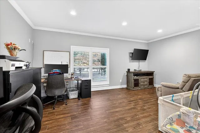 a workspace with furniture hardwood and a window