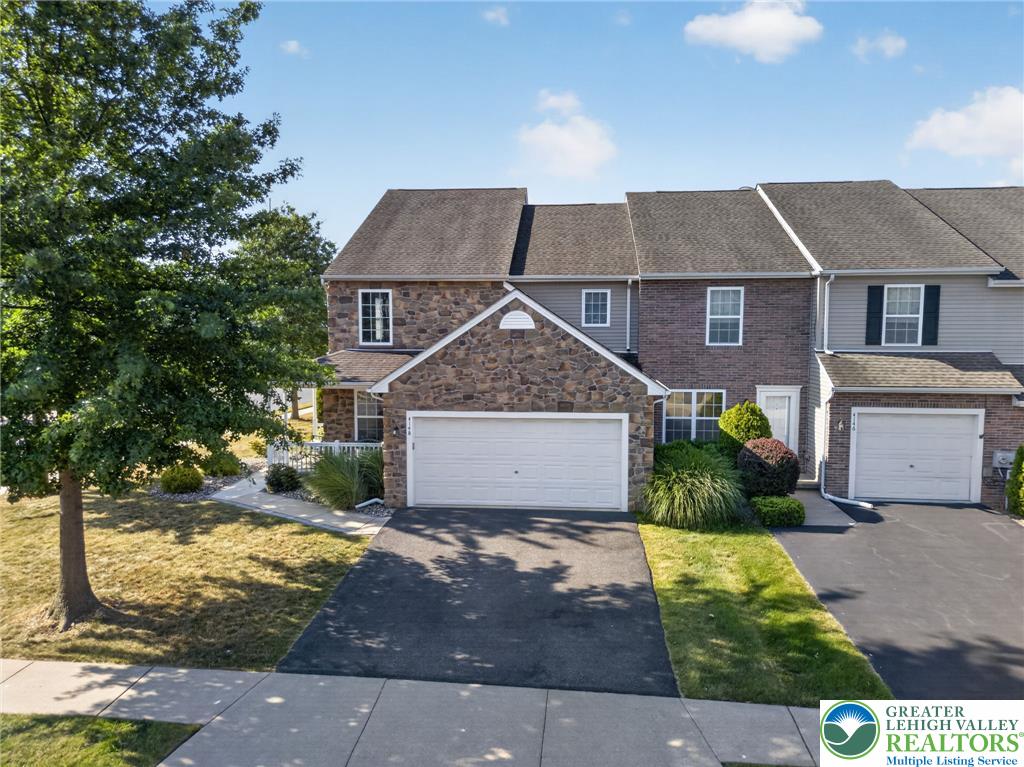 4148 Ross Road Bethlehem, PA 18020 - Photo 4 of 67 Stone and siding facade townhome with a private driveway and attached garage.