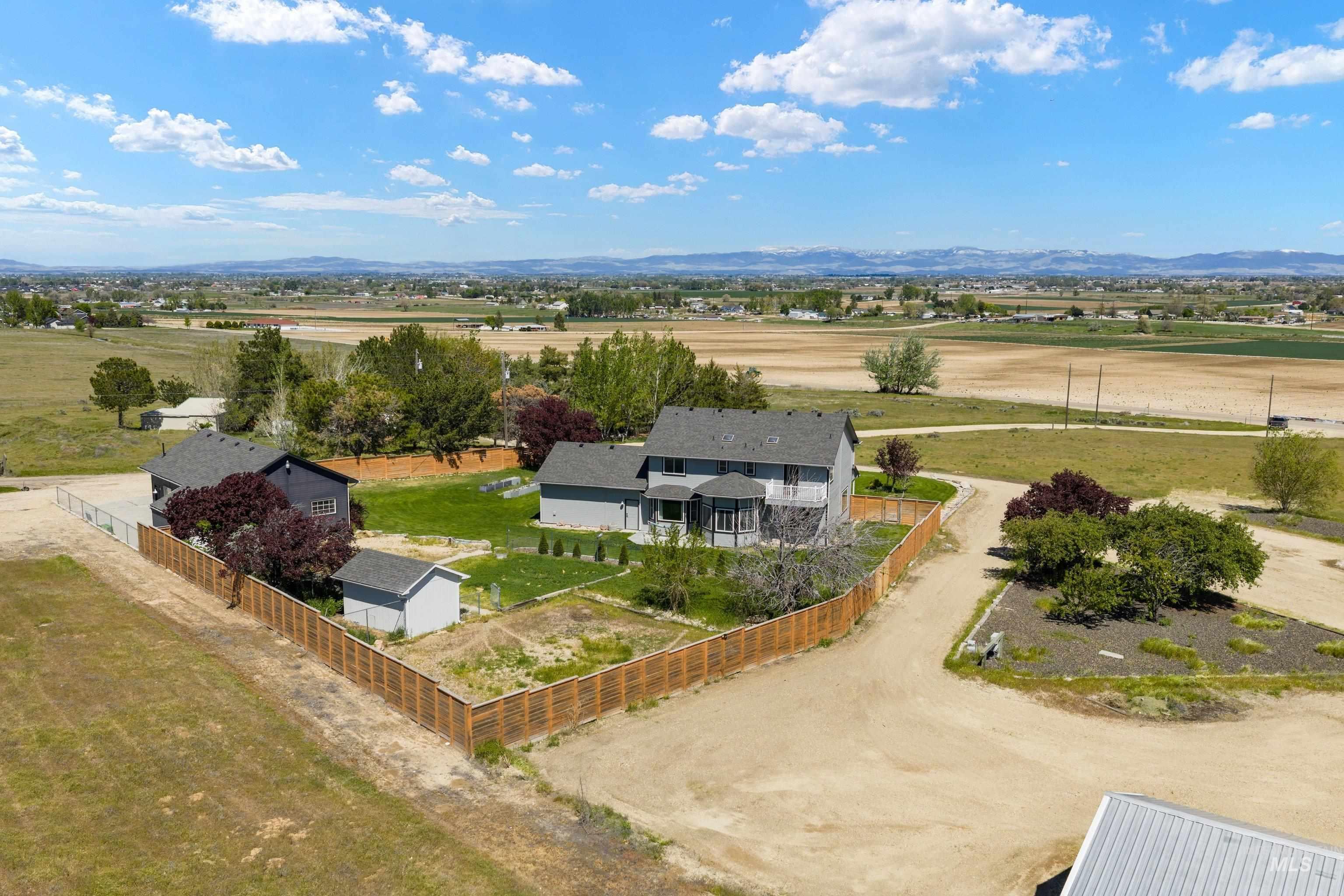 7657 Track Road Nampa, ID 83686 - Photo 2 of 49 Expansive property featuring two distinct structures, a fenced perimeter, and a detached shed