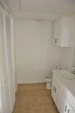 a small space with a fan and a fan