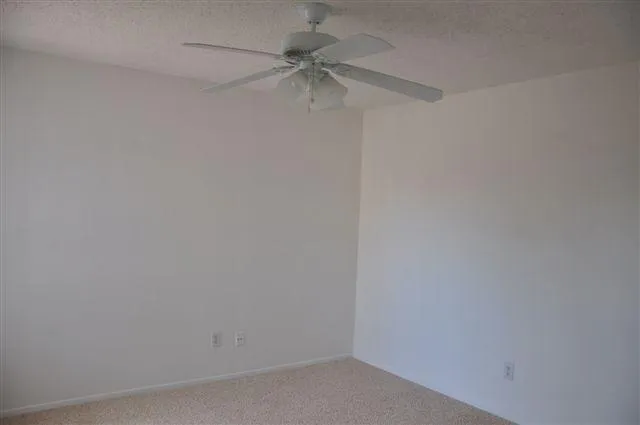 a view of room with window and hardwood floor