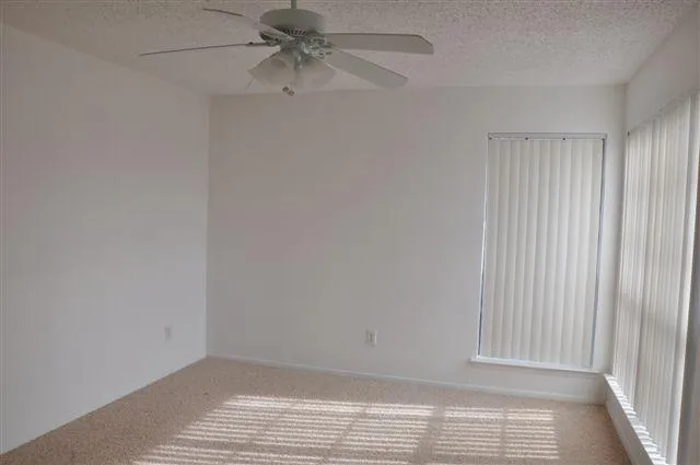 an empty room with a fireplace