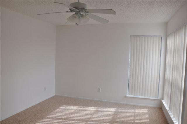 5630 Spring Valley Road, Unit 19B Dallas, TX 75254 - Photo 14 of 25 a view of room with window and hardwood floor
